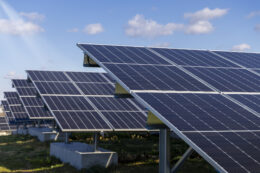 Solar panels on large racks embedded in concrete footings