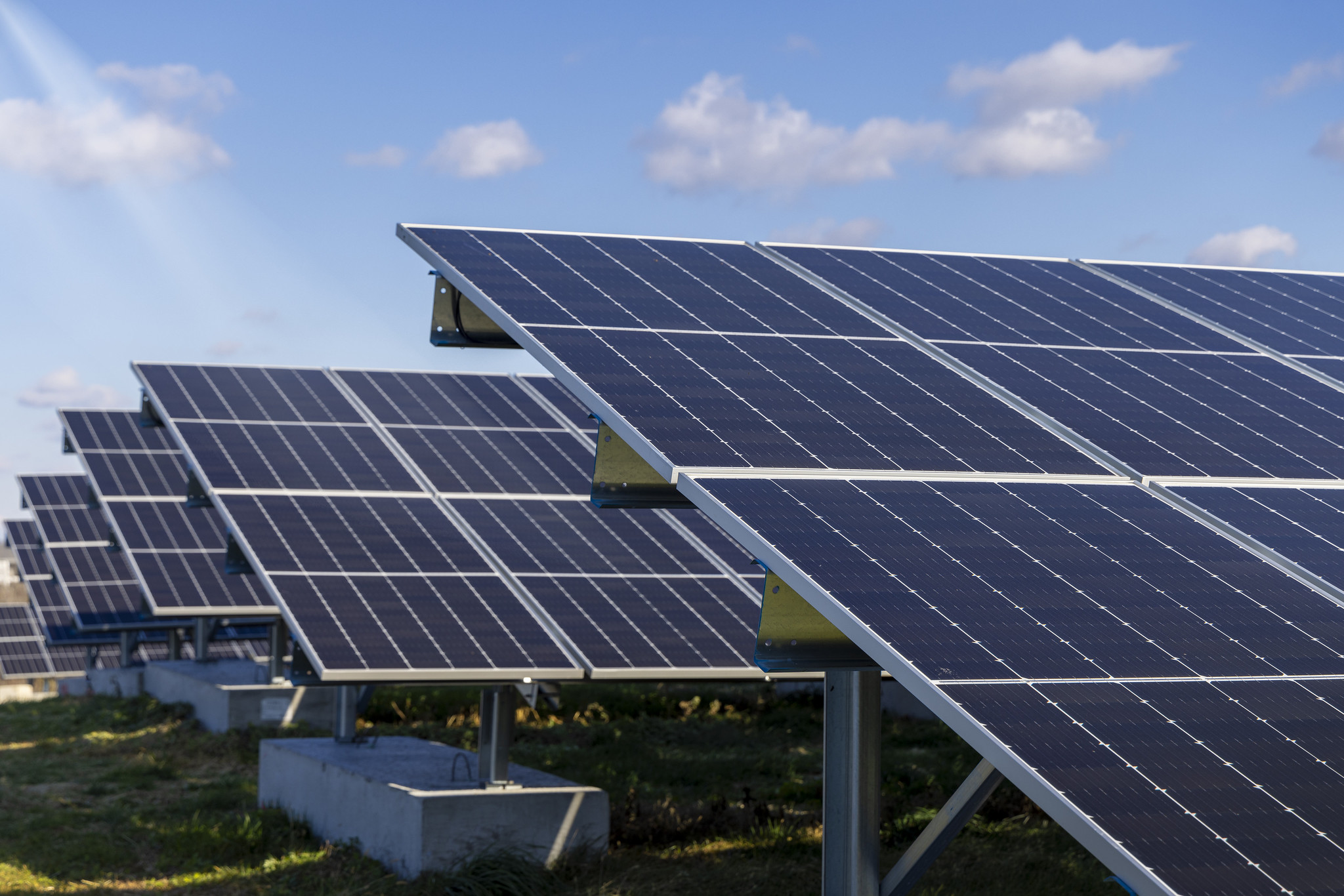 Solar panels on large racks embedded in concrete footings