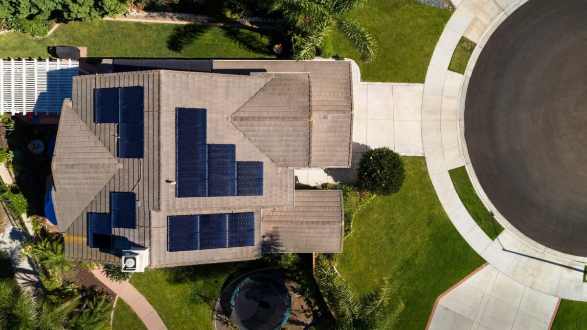 An overhead photo of a home with solar panels