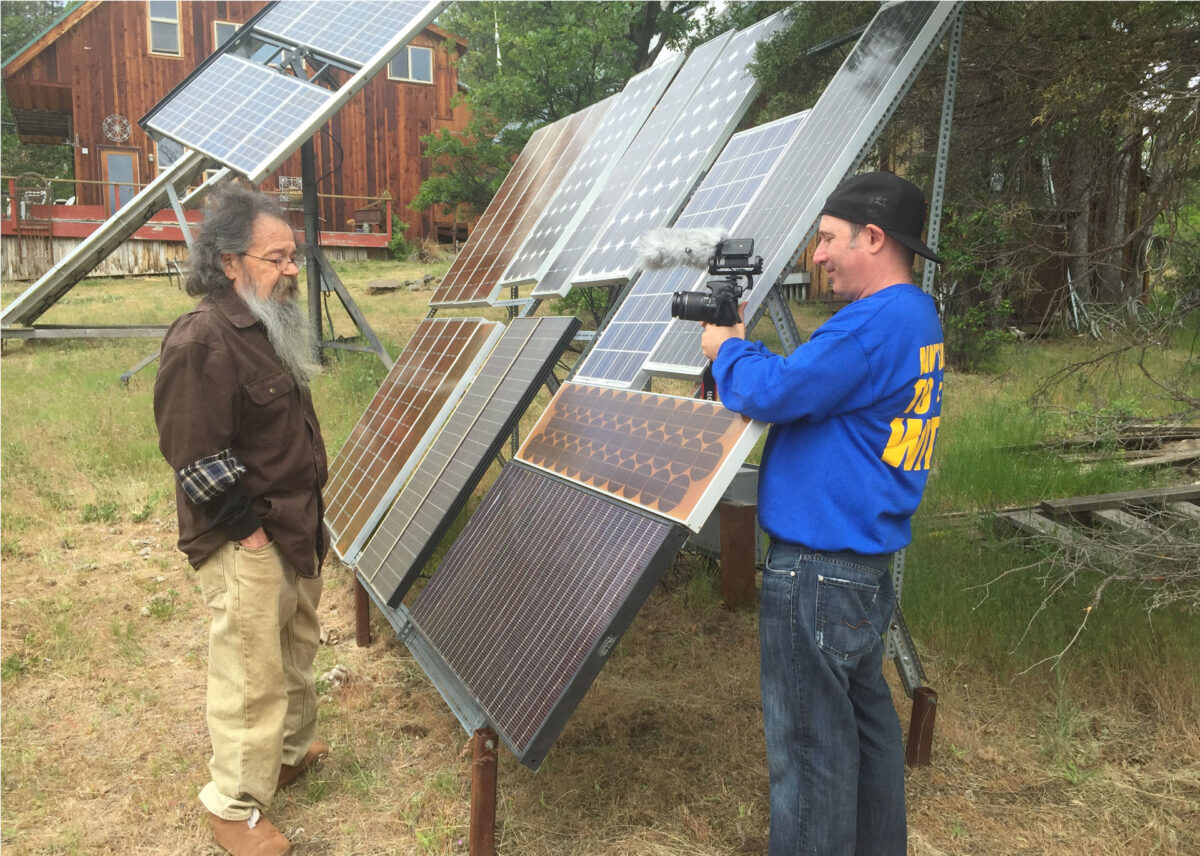 Richard Perez, founder of Home Power Magazine, showing of his “democracy” array to Jason Vetterli during the filming of the Solar Roots documentary.