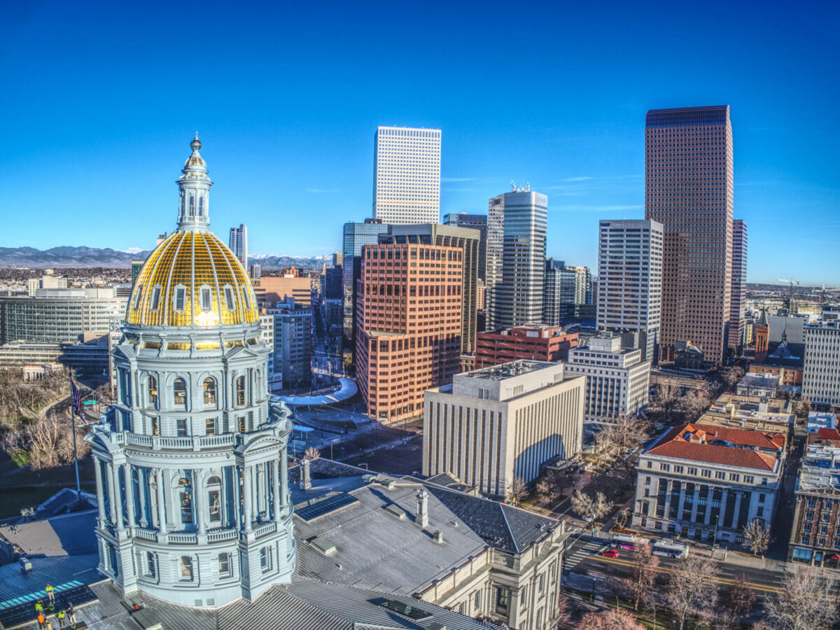 Colorado's capitol building with the PUC building in the background